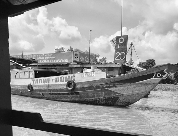 Barche di legno. Delta del Mekong